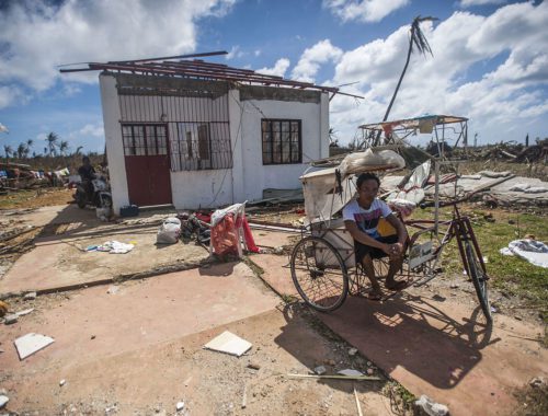 a_philippine_resident_sits_outside_of_his_home_in_the_aftermath_of_super_typhoon_haiyan_131115-n-bd107-722