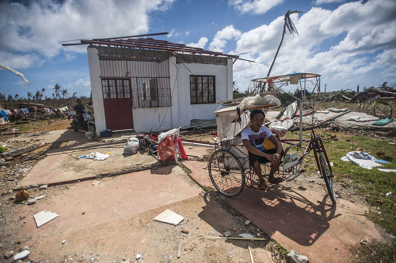 a_philippine_resident_sits_outside_of_his_home_in_the_aftermath_of_super_typhoon_haiyan_131115-n-bd107-722