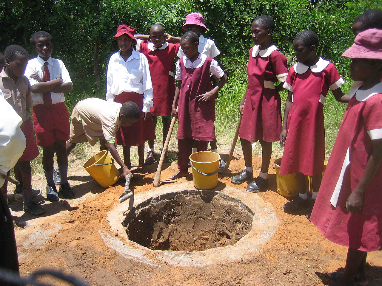school_children_in_zimbabwe_digging_a_shallow_pit_for_an_arborloo_toilet_a_variation_of_a_pit_latrine