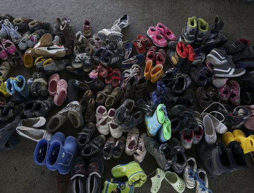 a_pile_of_children_shoes_captured_during_refugees_crisis