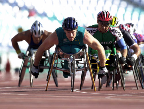 211000_-_athletics_wheelchair_racing_10km_heat_john_maclean_action_2_-_3b_-_2000_sydney_race_photo