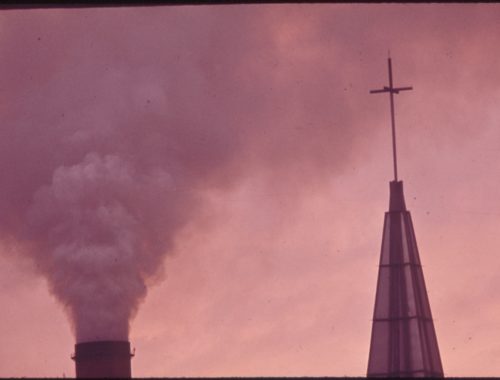 the_kaiser_aluminum_plant_smokestack_behind_the_catholic_church_belches_fumes_over_the_residential_area_in_the