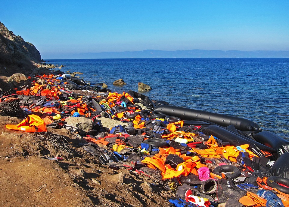 refugees-syria-war-beach-life-jackets-orange-3290742