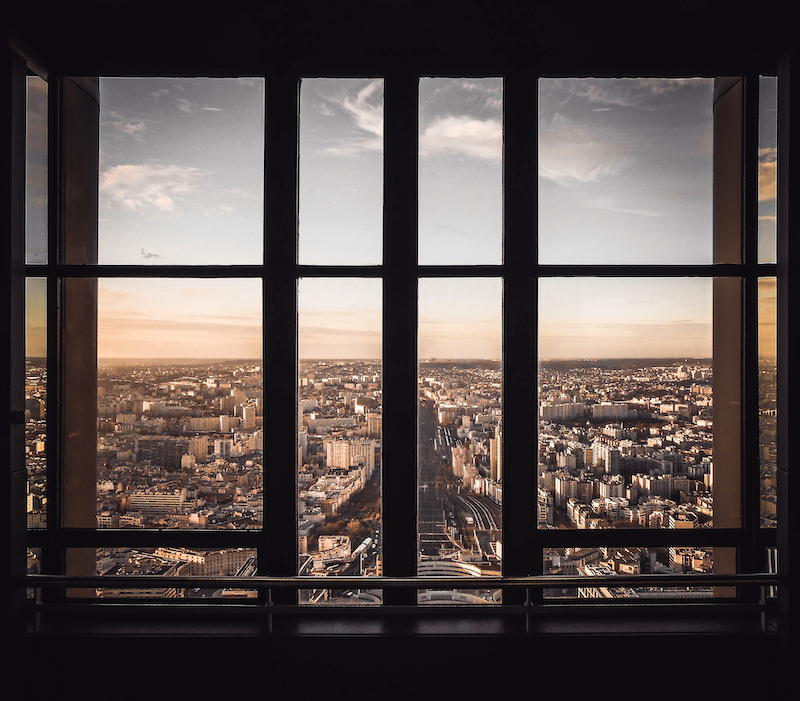city_view_from_window_frame_unsplash
